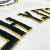 REFLECTED VARSITY TEE