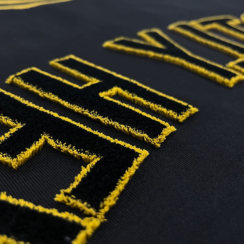 REFLECTED VARSITY TEE